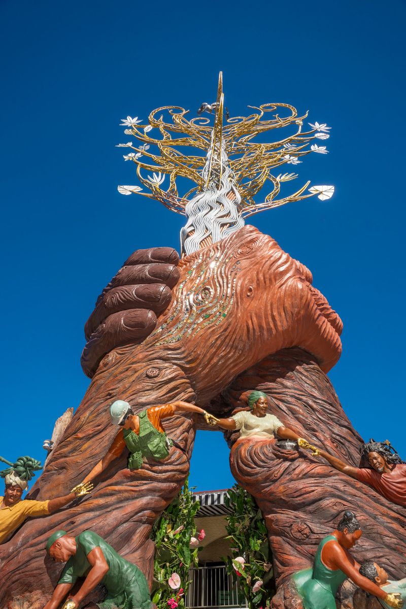 Looking up through the arch to the clasped hands and the Tree of Life